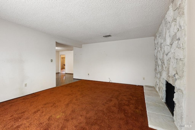 1417 Klamath Dr, Suisun City, CA 94585 - unfurnished living room featuring carpet flooring, a textured ceiling, and a fireplace