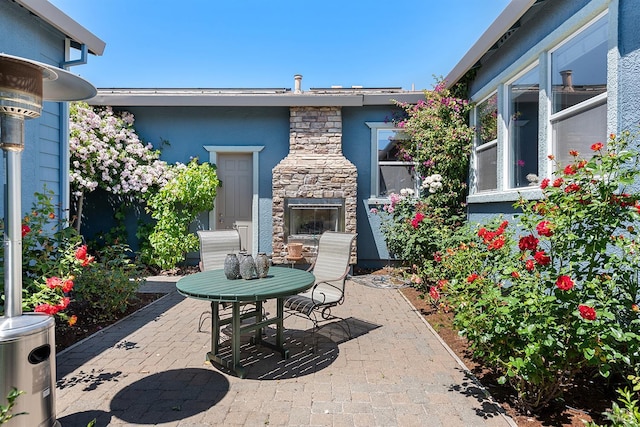 8596 Starr Rd, Windsor, CA 95492 - view of patio / terrace with an outdoor stone fireplace