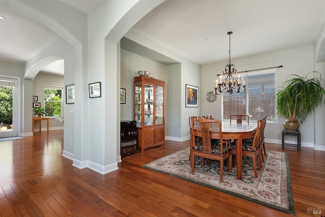 8596 Starr Rd, Windsor, CA 95492 - dining space featuring a chandelier, hardwood / wood-style floors, baseboards, and arched walkways