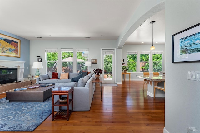 8596 Starr Rd, Windsor, CA 95492 - living room with arched walkways, hardwood / wood-style floors, and plenty of natural light