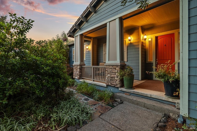 8596 Starr Rd, Windsor, CA 95492 - exterior entry at dusk with covered porch and stone siding