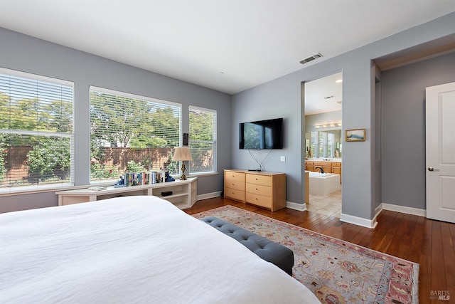 8596 Starr Rd, Windsor, CA 95492 - bedroom with hardwood / wood-style flooring, baseboards, and connected bathroom