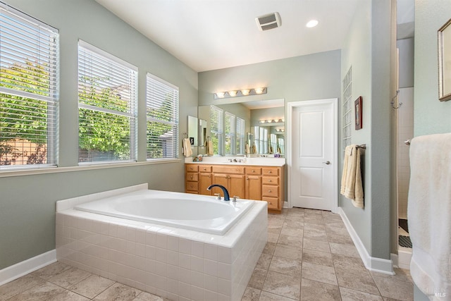 8596 Starr Rd, Windsor, CA 95492 - bathroom featuring vanity, a garden tub, healthy amount of natural light, and baseboards