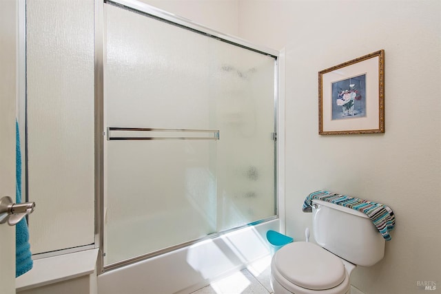 8596 Starr Rd, Windsor, CA 95492 - bathroom featuring toilet and bath / shower combo with glass door