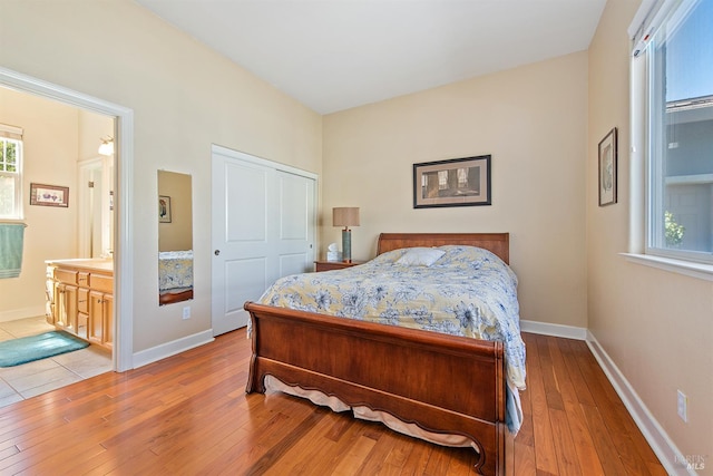 8596 Starr Rd, Windsor, CA 95492 - bedroom with light wood-style flooring, baseboards, and ensuite bathroom