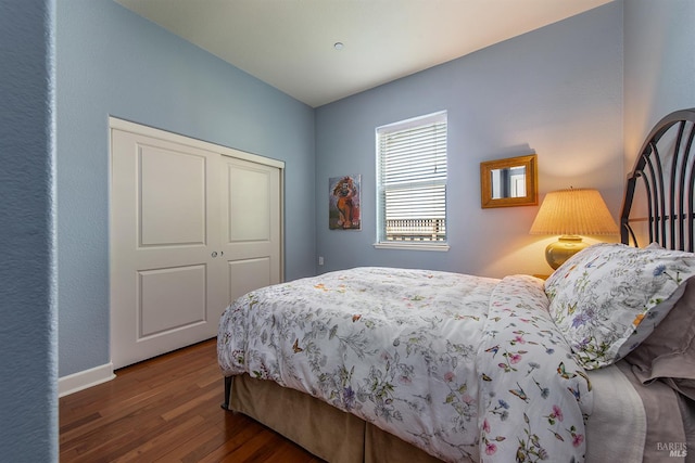 8596 Starr Rd, Windsor, CA 95492 - bedroom with wood finished floors, a closet, and baseboards