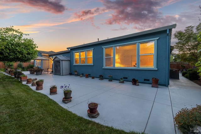 8596 Starr Rd, Windsor, CA 95492 - back of property at dusk featuring a patio and stucco siding
