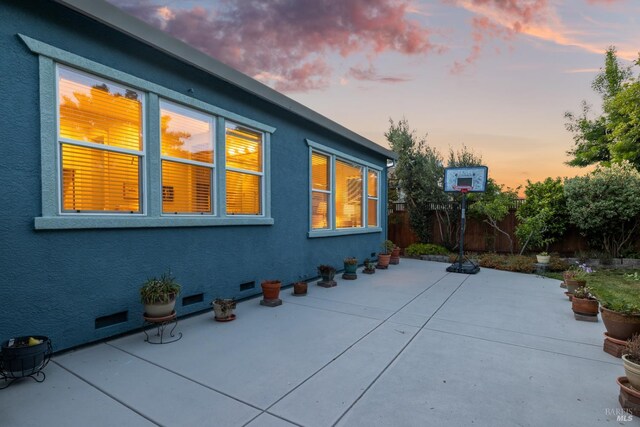8596 Starr Rd, Windsor, CA 95492 - property exterior at dusk featuring a fenced backyard, a patio area, and stucco siding