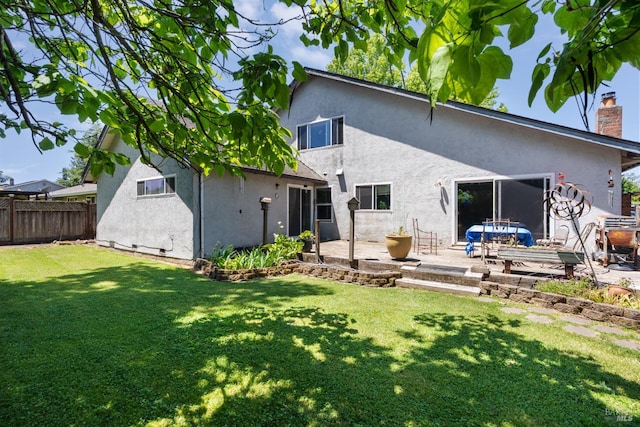 6048 Dawn Dr, Rohnert Park, CA 94928 - back of house featuring stucco siding, a patio, and a chimney
