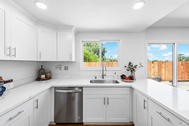 225 Riverview Dr, Vallejo, CA 94589 - kitchen with stainless steel dishwasher, a sink, white cabinetry, recessed lighting, and light stone countertops