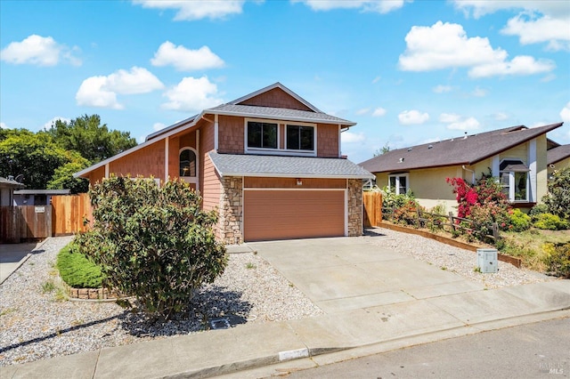 225 Riverview Dr, Vallejo, CA 94589 - view of front of house with stone siding, an attached garage, and driveway