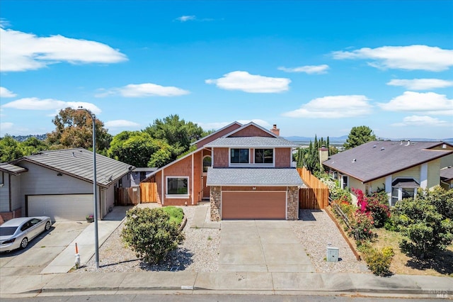 225 Riverview Dr, Vallejo, CA 94589 - view of front of home featuring driveway, stone siding, and a garage