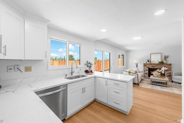 225 Riverview Dr, Vallejo, CA 94589 - kitchen featuring dishwasher, a sink, white cabinetry, a peninsula, and recessed lighting