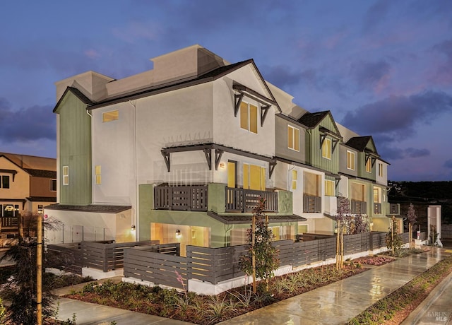 5203 Dalai Lama Ave, Richmond, CA 94804 - view of front facade with stucco siding and a balcony