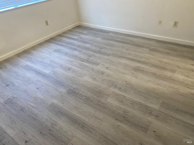225 Pennsylvania Ave Unit E7, Fairfield, CA 94533 - spare room featuring wood finished floors and baseboards