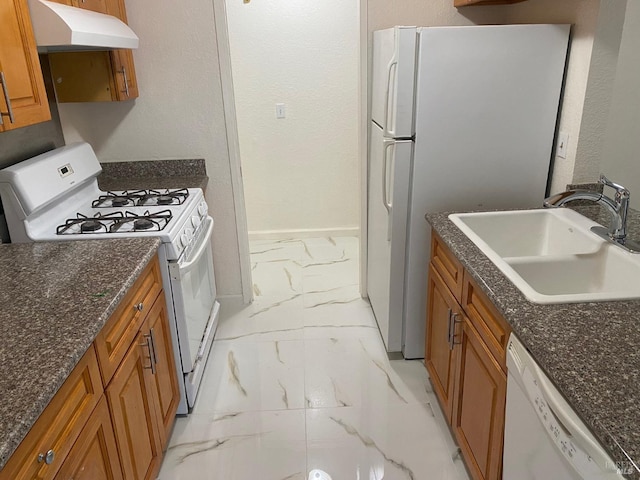 225 Pennsylvania Ave Unit E7, Fairfield, CA 94533 - kitchen with white appliances, light marble finish flooring, under cabinet range hood, a sink, and brown cabinetry