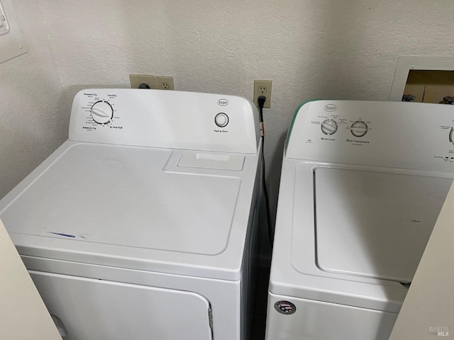 225 Pennsylvania Ave Unit E7, Fairfield, CA 94533 - washroom featuring washer and dryer and a textured wall