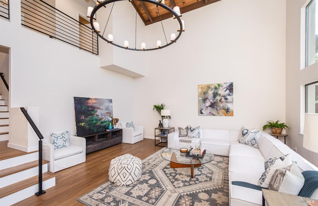1043 La Quinta Ct, Napa, CA 94559 - living area featuring a towering ceiling, stairway, wood finished floors, a chandelier, and baseboards