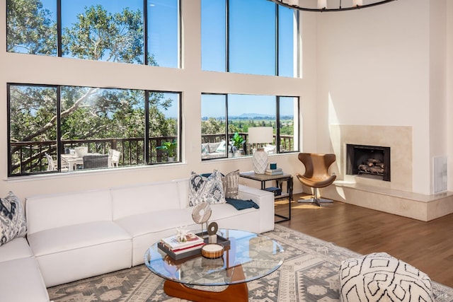 1043 La Quinta Ct, Napa, CA 94559 - living room with wood finished floors, a towering ceiling, and a fireplace