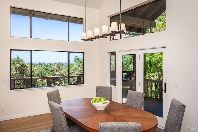 1043 La Quinta Ct, Napa, CA 94559 - dining space featuring baseboards, a high ceiling, and wood finished floors