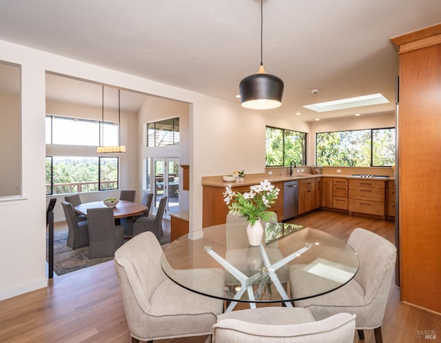 1043 La Quinta Ct, Napa, CA 94559 - dining room featuring light wood finished floors, a skylight, and baseboards
