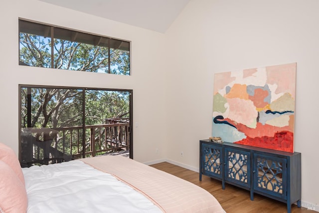 1043 La Quinta Ct, Napa, CA 94559 - bedroom featuring high vaulted ceiling, access to outside, wood finished floors, and baseboards
