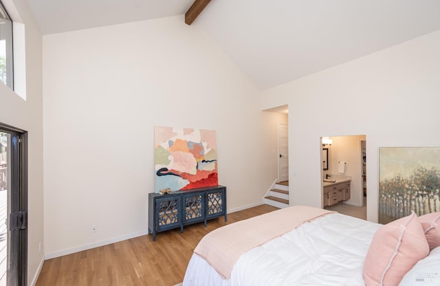 1043 La Quinta Ct, Napa, CA 94559 - bedroom with high vaulted ceiling, multiple windows, light wood-style flooring, beam ceiling, and baseboards