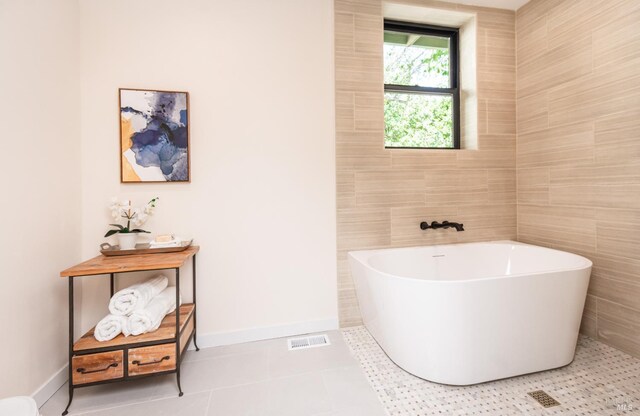 1043 La Quinta Ct, Napa, CA 94559 - bathroom with a freestanding bath, tile patterned flooring, baseboards, and tile walls