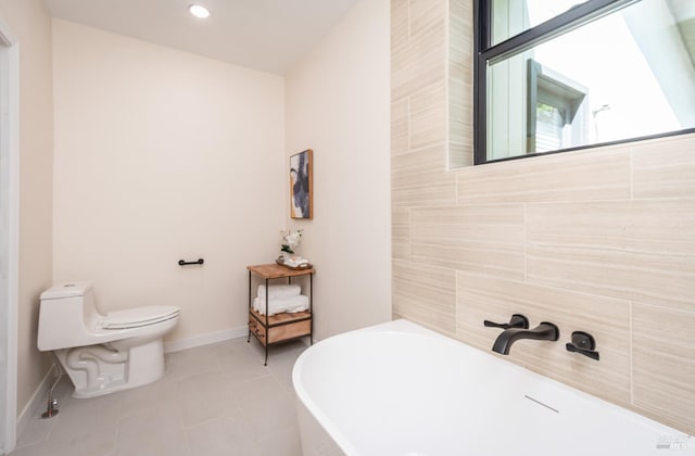 1043 La Quinta Ct, Napa, CA 94559 - bathroom with a freestanding bath, baseboards, tile patterned floors, and toilet