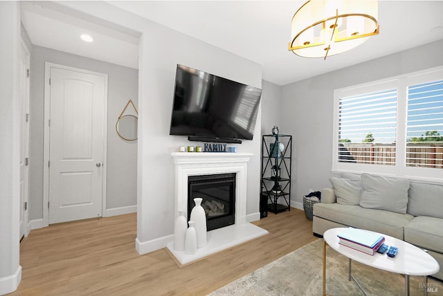 840 Allegro Ct, Fairfield, CA 94534 - living area featuring wood finished floors, baseboards, a glass covered fireplace, and recessed lighting