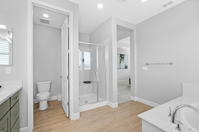 840 Allegro Ct, Fairfield, CA 94534 - bathroom featuring vanity, wood finished floors, a stall shower, toilet, and healthy amount of natural light