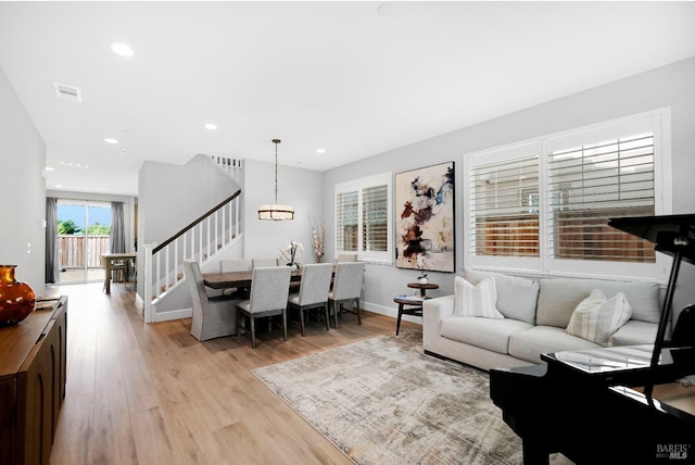 840 Allegro Ct, Fairfield, CA 94534 - living room featuring light wood-type flooring, stairs, a chandelier, recessed lighting, and baseboards
