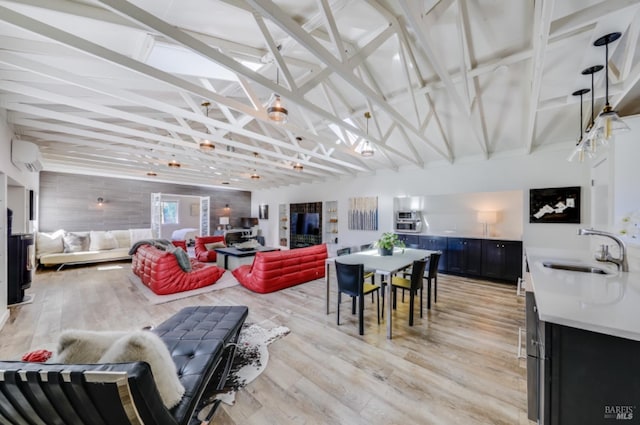 1067 Darms Ln, Napa, CA 94558 - living room featuring an AC wall unit, light wood-style floors, and vaulted ceiling