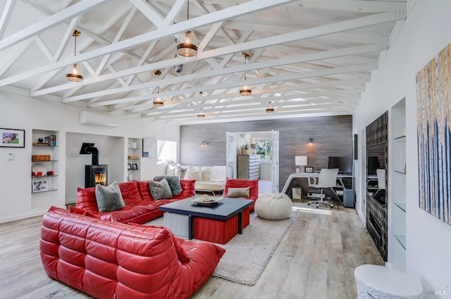 1067 Darms Ln, Napa, CA 94558 - living room with a wall mounted AC, wood finished floors, a wood stove, high vaulted ceiling, and beamed ceiling