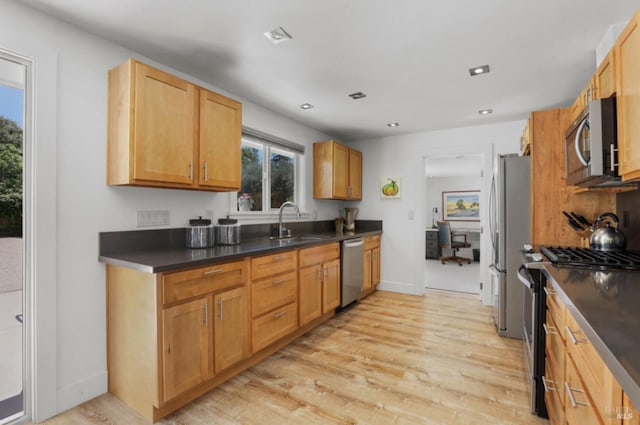 1067 Darms Ln, Napa, CA 94558 - kitchen with appliances with stainless steel finishes, a sink, dark countertops, light wood-type flooring, and recessed lighting