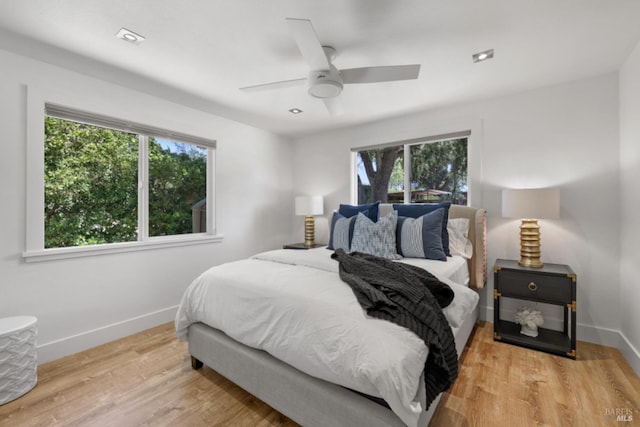 1067 Darms Ln, Napa, CA 94558 - bedroom featuring multiple windows, baseboards, wood finished floors, and ceiling fan