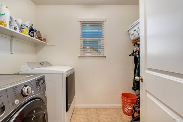 236 Cogburn Way, Vacaville, CA 95687 - washroom featuring independent washer and dryer, baseboards, and light tile patterned floors