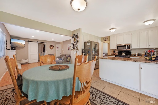 1405 Montana Pl, Rohnert Park, CA 94928 - dining room featuring a barn door, light tile patterned flooring, and recessed lighting