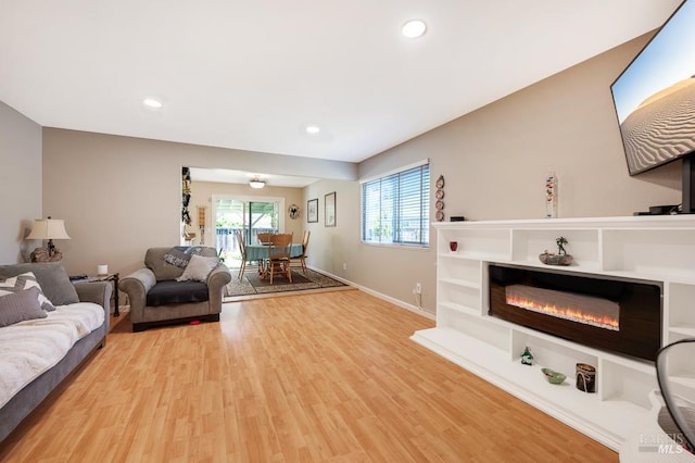 1405 Montana Pl, Rohnert Park, CA 94928 - living room with wood finished floors, baseboards, recessed lighting, and a glass covered fireplace