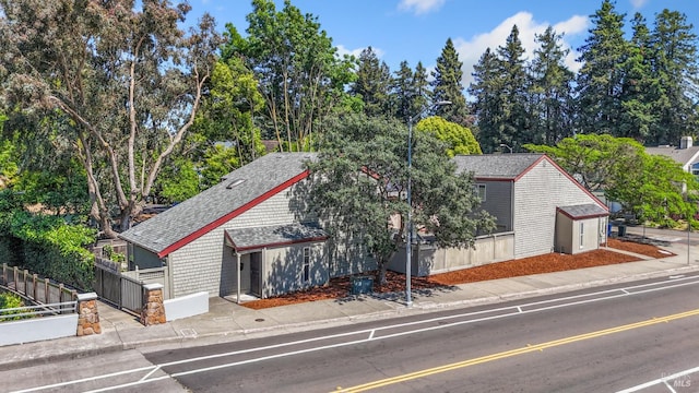 50 S A St, Santa Rosa, CA 95401 - view of front facade featuring roof with shingles and view of scattered trees