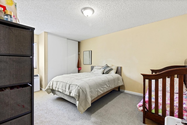 50 S A St, Santa Rosa, CA 95401 - carpeted bedroom with a closet, a textured ceiling, and baseboards