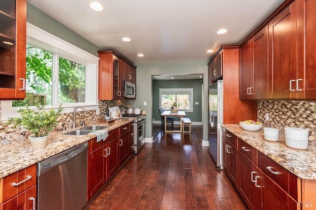 225 Berna Ave, Napa, CA 94559 - kitchen with stainless steel appliances, a sink, light stone counters, tasteful backsplash, and glass insert cabinets