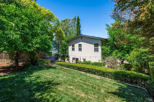 225 Berna Ave, Napa, CA 94559 - back of house featuring stucco siding and a hot tub