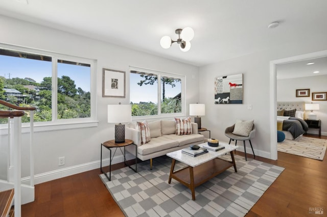 1131 W California Ave, Mill Valley, CA 94941 - living room featuring hardwood / wood-style flooring, baseboards, and a chandelier