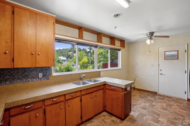 1205 Cambridge St, Novato, CA 94947 - kitchen featuring light countertops, a sink, a ceiling fan, tasteful backsplash, and baseboards