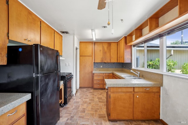 1205 Cambridge St, Novato, CA 94947 - kitchen with black appliances, a sink, brown cabinets, and light countertops