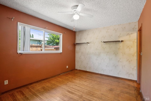 1205 Cambridge St, Novato, CA 94947 - spare room featuring a textured ceiling, light wood-type flooring, ceiling fan, and baseboards