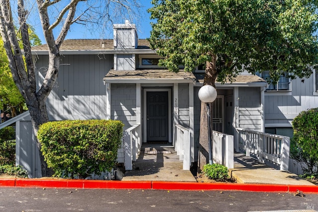 2000 Clearview Cir, Benicia, CA 94510 - view of front of home featuring a shingled roof and a chimney