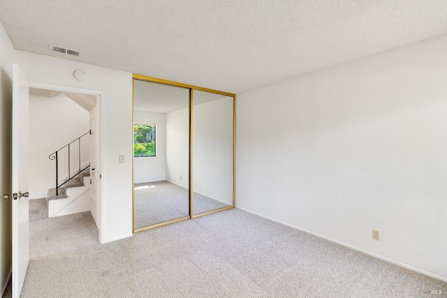 2000 Clearview Cir, Benicia, CA 94510 - unfurnished bedroom featuring carpet, a textured ceiling, a closet, and baseboards
