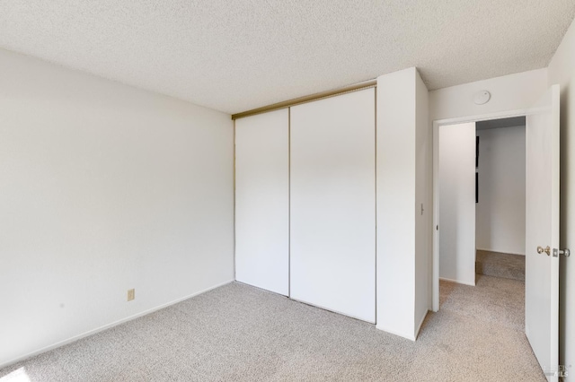 2000 Clearview Cir, Benicia, CA 94510 - unfurnished bedroom featuring light carpet, a textured ceiling, and a closet